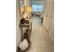 Inviting entryway with neutral tile flooring, console table, and decorative accents provides a warm welcome at 746 Longboat Dr, Davenport, FL 33896
