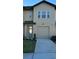 Charming two-story home featuring a one car garage, well maintained lawn, and inviting curb appeal at 746 Longboat Dr, Davenport, FL 33896