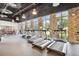 A modern fitness center showcasing rows of treadmills, cardio machines, and large windows for natural light at 746 Longboat Dr, Davenport, FL 33896