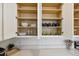 Kitchen cabinets featuring dishes, cups, and glasses with ample storage space at 746 Longboat Dr, Davenport, FL 33896