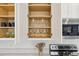 Neatly organized kitchen cabinet with wine glasses and drinking glasses at 746 Longboat Dr, Davenport, FL 33896