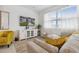 Cozy living room area with plush seating, a view of the outside, and modern decor accents at 746 Longboat Dr, Davenport, FL 33896