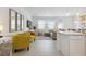 Spacious living area featuring a kitchen island, comfortable seating, and stylish interior design at 746 Longboat Dr, Davenport, FL 33896