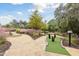 Picturesque mini golf course featuring lush landscaping, stone paths, and manicured greens at 746 Longboat Dr, Davenport, FL 33896