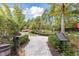 Charming mini golf course offering a relaxing outdoor experience with serene landscaping and shady trees at 746 Longboat Dr, Davenport, FL 33896