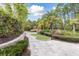 Scenic mini golf course featuring lush landscaping, palm trees, and well-maintained greens at 746 Longboat Dr, Davenport, FL 33896
