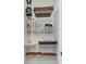Organized pantry with wire shelving for food storage and kitchen appliances at 746 Longboat Dr, Davenport, FL 33896