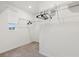 Walk-in closet with carpeted floor, a window, and white wire shelving for storage at 746 Longboat Dr, Davenport, FL 33896