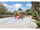 Outdoor water park area features a boat themed water play structure with slides and splash pad at 746 Longboat Dr, Davenport, FL 33896