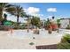 Outdoor water park area with playful water features, shaded seating, and a splash pad with pirate ship slide at 746 Longboat Dr, Davenport, FL 33896