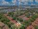 An aerial view shows property lines of this community, near the lake and shopping center, surrounded by lush landscaping at 8035 Bayside View Dr, Orlando, FL 32819