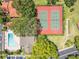 Aerial view of community tennis and bocce ball courts, and pool at 8035 Bayside View Dr, Orlando, FL 32819