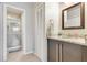 Bathroom featuring granite countertops, updated vanity and new tile in the glass enclosed shower at 8035 Bayside View Dr, Orlando, FL 32819