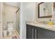 Bathroom with granite countertops, modern vanity, updated fixtures and glass enclosed shower at 8035 Bayside View Dr, Orlando, FL 32819