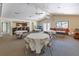 Spacious clubhouse lounge area with comfortable seating, tables, and a kitchenette for social gatherings at 8035 Bayside View Dr, Orlando, FL 32819