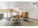Relaxing clubhouse features tables, chairs and a comfortable seating area for residents to enjoy social gatherings and events at 8035 Bayside View Dr, Orlando, FL 32819