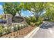 Elegant Sandpointe community entrance sign with stone pillars surrounded by landscaped greenery and beautiful mature trees at 8035 Bayside View Dr, Orlando, FL 32819