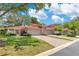 Charming villa boasts lush landscaping, red tile roof, and well-manicured lawn at 8035 Bayside View Dr, Orlando, FL 32819