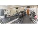 The fitness center features modern exercise equipment, mirrors, and ample space for a complete workout experience at 8035 Bayside View Dr, Orlando, FL 32819