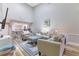 Cozy living room with open access to the kitchen and light colored furniture at 8035 Bayside View Dr, Orlando, FL 32819