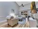 Bright living room with vaulted ceilings, a ceiling fan, and large windows that allow plenty of natural light at 8035 Bayside View Dr, Orlando, FL 32819
