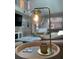 Stylish living room lamp with a glass globe and modern design at 8035 Bayside View Dr, Orlando, FL 32819