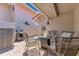 Cozy patio area with outdoor seating, a grill, and a charming fire pit at 8035 Bayside View Dr, Orlando, FL 32819