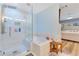 This bathroom features a corner soaking tub and a walk-in shower with light tile and glass door at 8035 Bayside View Dr, Orlando, FL 32819