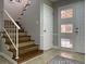 A staircase with stained wood steps, white risers and a white railing, set against neutral walls at 8035 Bayside View Dr, Orlando, FL 32819