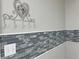 A decorative heart hook and horizontal grey tile accent the wall space at 8035 Bayside View Dr, Orlando, FL 32819