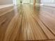 A close-up captures the rich, natural grain of the wood flooring, showcasing its smooth finish at 8035 Bayside View Dr, Orlando, FL 32819