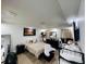 Neutral toned bedroom with dark furniture, wooden floors and ample lighting at 807 Knightsbridge Cir, Davenport, FL 33896