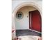 Welcoming front door with brick accents and a round window detail at 807 Knightsbridge Cir, Davenport, FL 33896