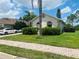 Charming single-story home with lush landscaping and a well-maintained lawn at 807 Knightsbridge Cir, Davenport, FL 33896