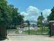 Community gate provides security and controlled access to the neighborhood, ensuring privacy and safety at 807 Knightsbridge Cir, Davenport, FL 33896