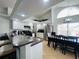 Bright kitchen featuring white cabinets, granite countertops, and stainless steel appliances at 807 Knightsbridge Cir, Davenport, FL 33896