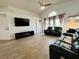 Spacious living room with vaulted ceilings, a ceiling fan, and a wall-mounted TV at 807 Knightsbridge Cir, Davenport, FL 33896