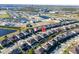 High-angle view of homes with neatly arranged houses, landscaping, and neighborhood ponds at 8085 Ludington Cir, Orlando, FL 32836