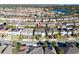 Wide aerial shot of a residential area with a lake in the background, highlighting the property's location at 8085 Ludington Cir, Orlando, FL 32836