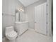 Clean bathroom with marble floors, a modern sink, and a white vanity at 8085 Ludington Cir, Orlando, FL 32836