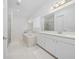A bright bathroom featuring double sinks, a soaking tub, and clean, modern finishes at 8085 Ludington Cir, Orlando, FL 32836