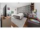 Stylish bedroom with a brick accent wall, grey furniture, and a modern design, offering a unique aesthetic at 8085 Ludington Cir, Orlando, FL 32836
