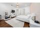 Bright bedroom with a modern chandelier, wood floors, and ample space for relaxation and decor at 8085 Ludington Cir, Orlando, FL 32836