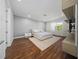 Serene bedroom with hardwood floors, a modern bed, and neutral tones creating a relaxing atmosphere at 8085 Ludington Cir, Orlando, FL 32836