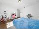 Inviting bedroom with a cozy blue bed, a workspace, and soft lighting, ideal for relaxation at 8085 Ludington Cir, Orlando, FL 32836