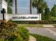 Estates at Parkside community entrance sign with beautiful landscaping and brick pathway at 8085 Ludington Cir, Orlando, FL 32836