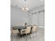Dining area showcasing contemporary table, seating and large window that offers natural light at 8085 Ludington Cir, Orlando, FL 32836