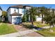 Charming two-story home showcasing a brick driveway, lush lawn, and a two-car garage at 8085 Ludington Cir, Orlando, FL 32836