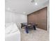 Entertaining game room featuring a pool table, plush carpet, comfortable seating, and stylish accent wall at 8085 Ludington Cir, Orlando, FL 32836
