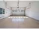 Clean, empty garage with a neutral floor and overhead door at 8085 Ludington Cir, Orlando, FL 32836